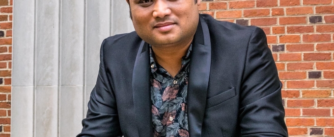 photo of man with brick building background