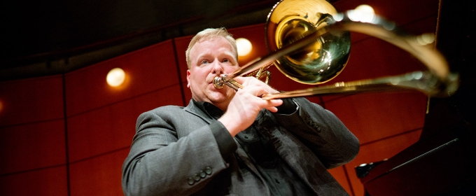 photo of man playing trombone