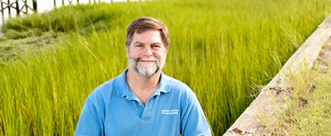 man in marsh, photo