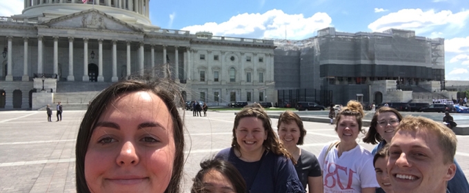 photo of eight students with US capitol building