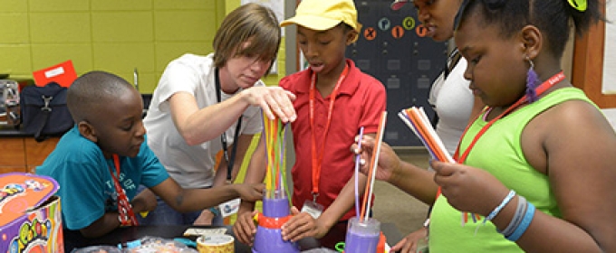 kids making art in a classroom