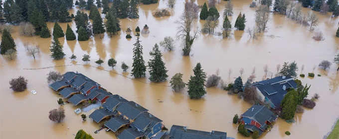 photo of area with flooding and house rooftops