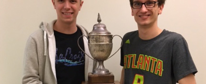 two men with trophy