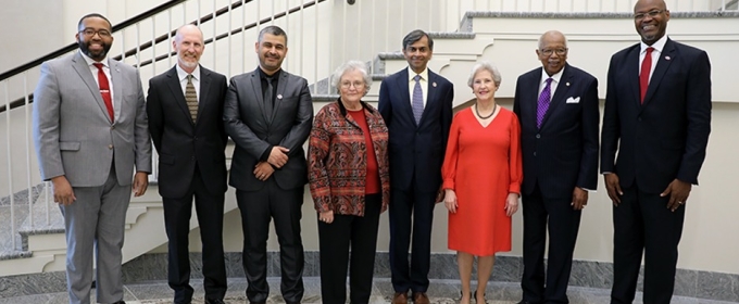 group photo of eight people