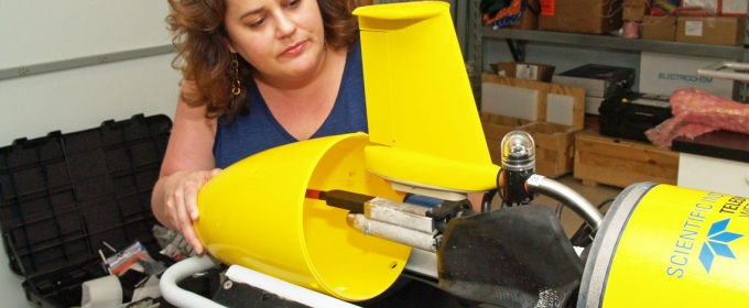 photo of woman with underwater robotic glider