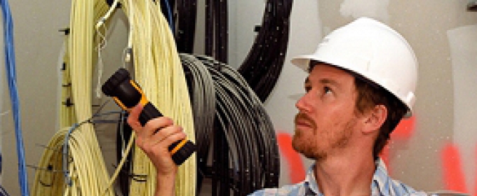 man in hard hat, with flashlight