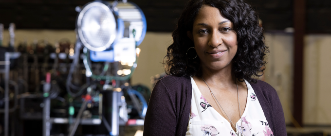 photo of woman, with lighting rig in background