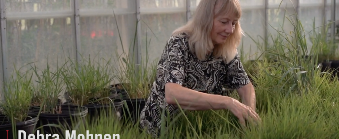 photo of woman in greenhouse, with white text