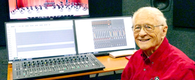 photo of man at recording board