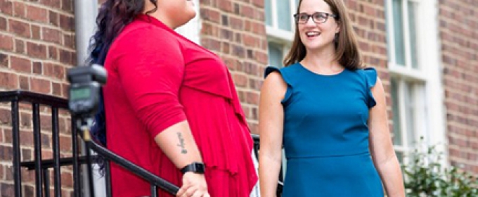 two women on stairs outside of Old College