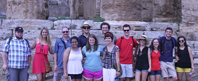 students with Greek ruins