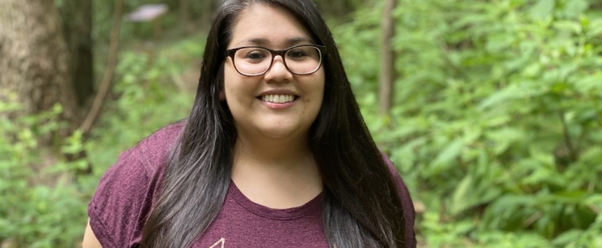 photo of woman outdoors, trees in background