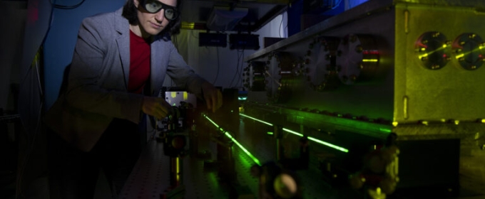 photo of woman in lab with laser