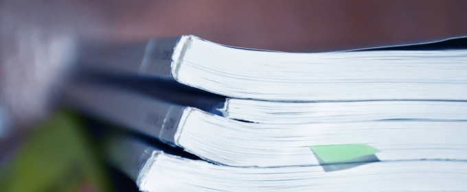 photo of small stack of bound manuscripts