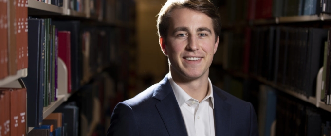 photo of man in library