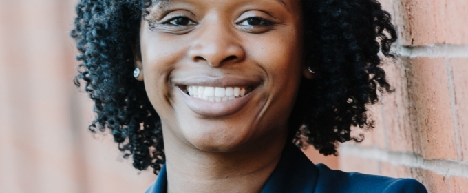 headshot of photo woman, with wall