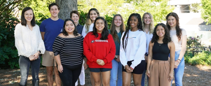 photo of group of people, outdoors, tree in background