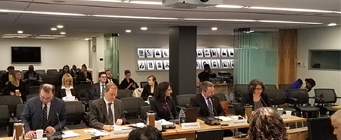 people seated in a briefing room