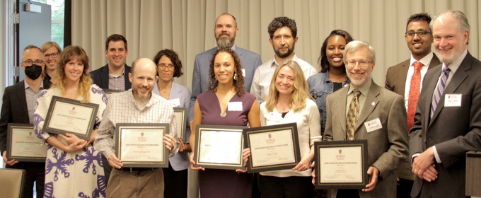 group photo of people holding plaques