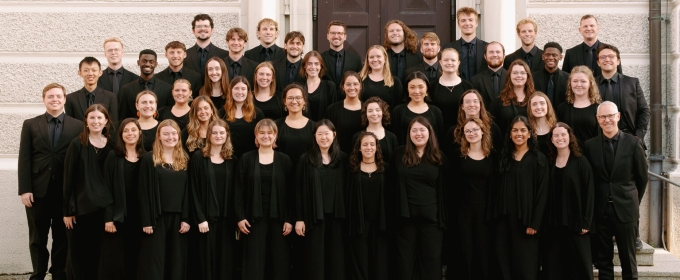 group photo of people, in black suits and gowns