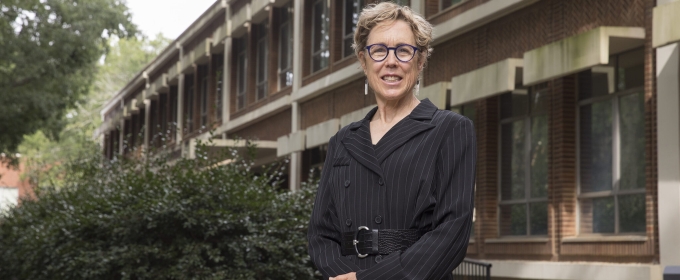 photo of woman outside of building, day